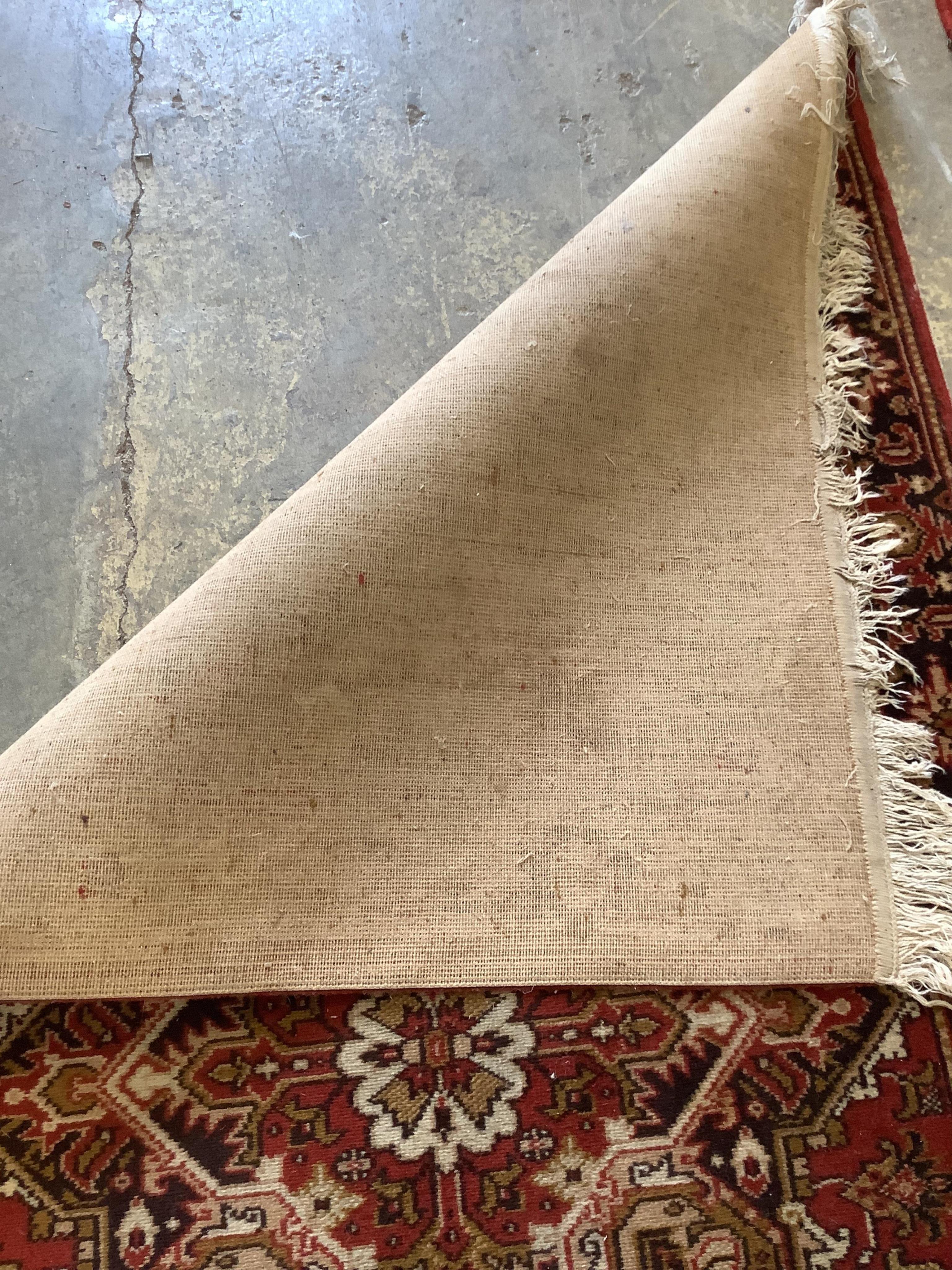 A Kandahar red ground rug and a similar runner, larger 294 x 200cm (2). Condition - poor